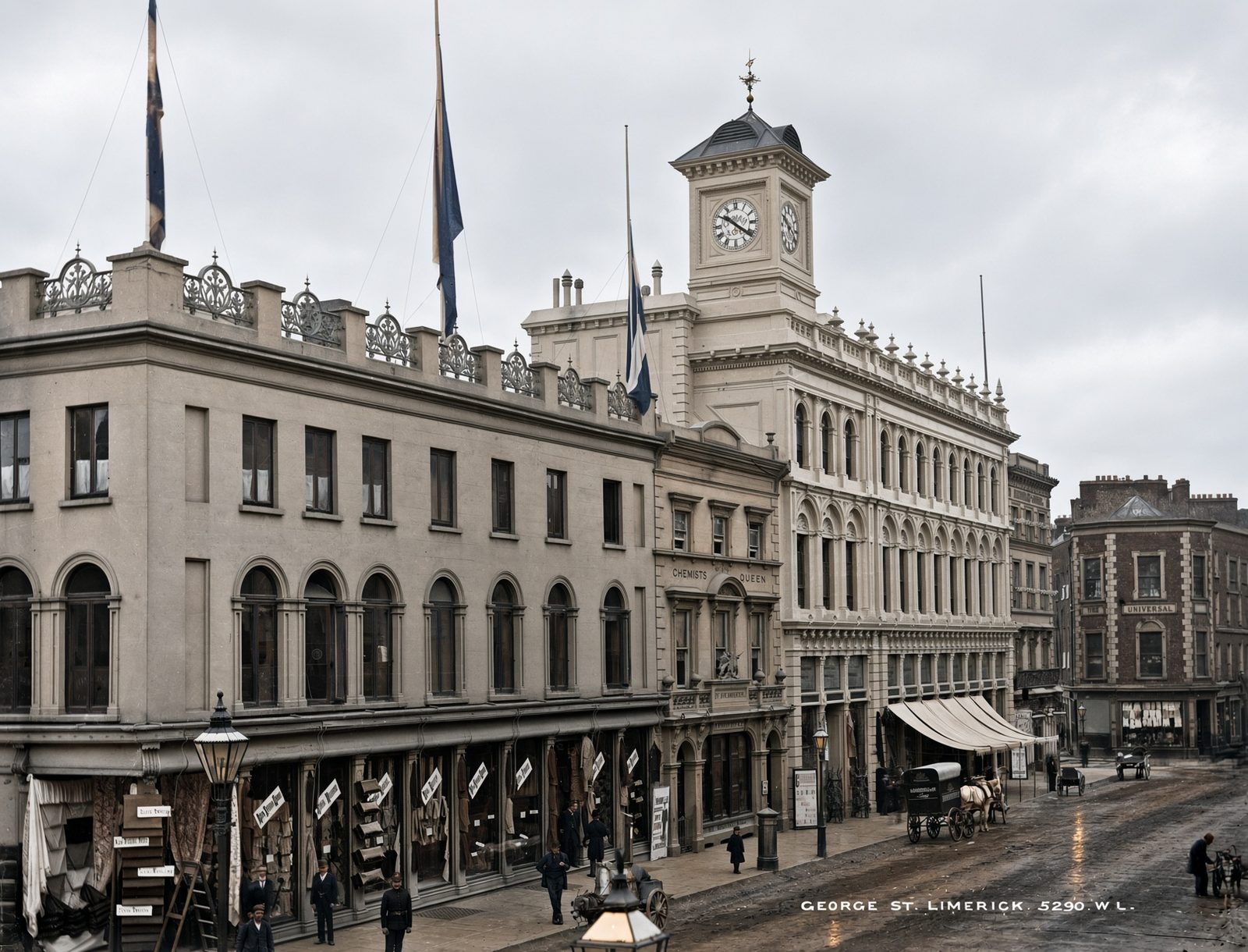 George Street in Limerick, a wide street of tall shopfronts with a clock tower.